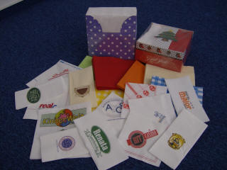 ARTEK paper napkins with the logo of manufacturer clients in Poland